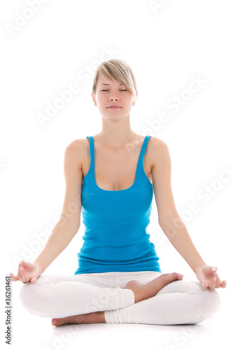 Portrait of a young healthy woman doing yoga exercises