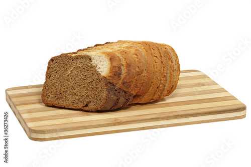 Fresh sliced bread on cutting board.