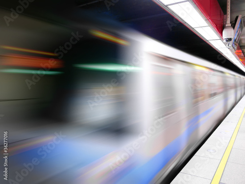 Moving train in subway station © marchcattle