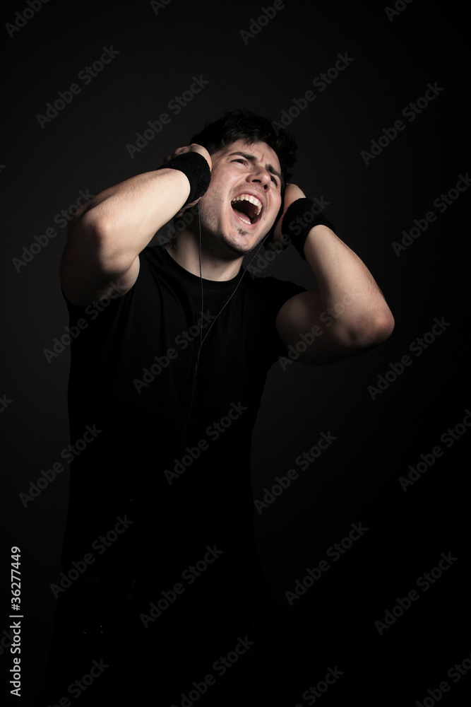 Young male person listening to music
