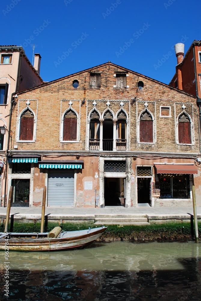 Old house facade on Murano island, Venice, Italy Old house facade on Murano island, Venice, Italy
