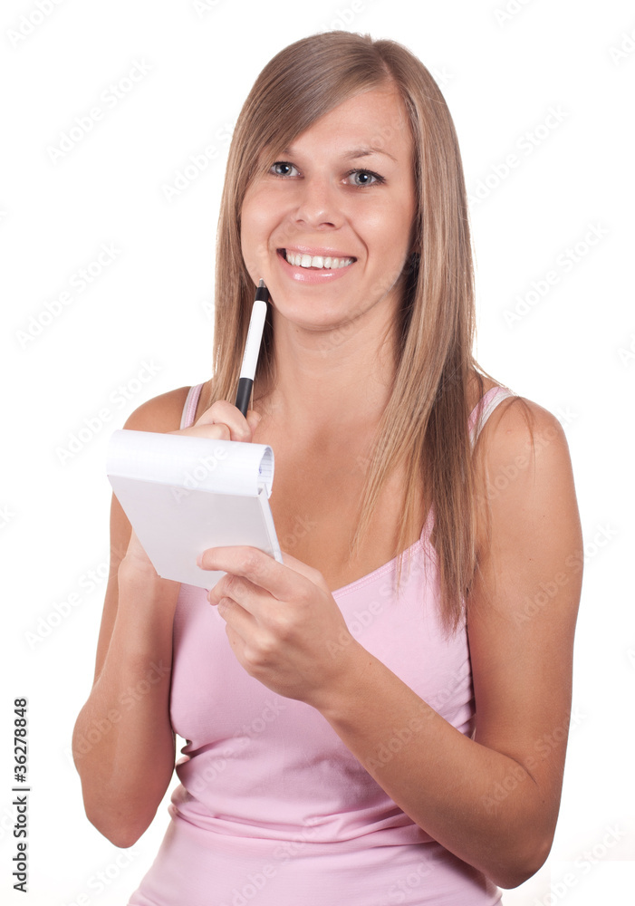 beautiful young woman writing in notepad beautiful young woman writing in notepad