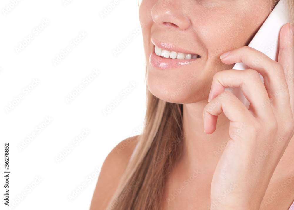 Portrait of a smiling young woman talking on mobile phone
