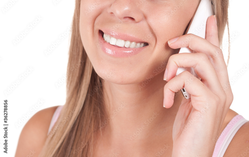Portrait of a smiling young woman talking on mobile phone Portrait of a smiling young woman talking on mobile phone