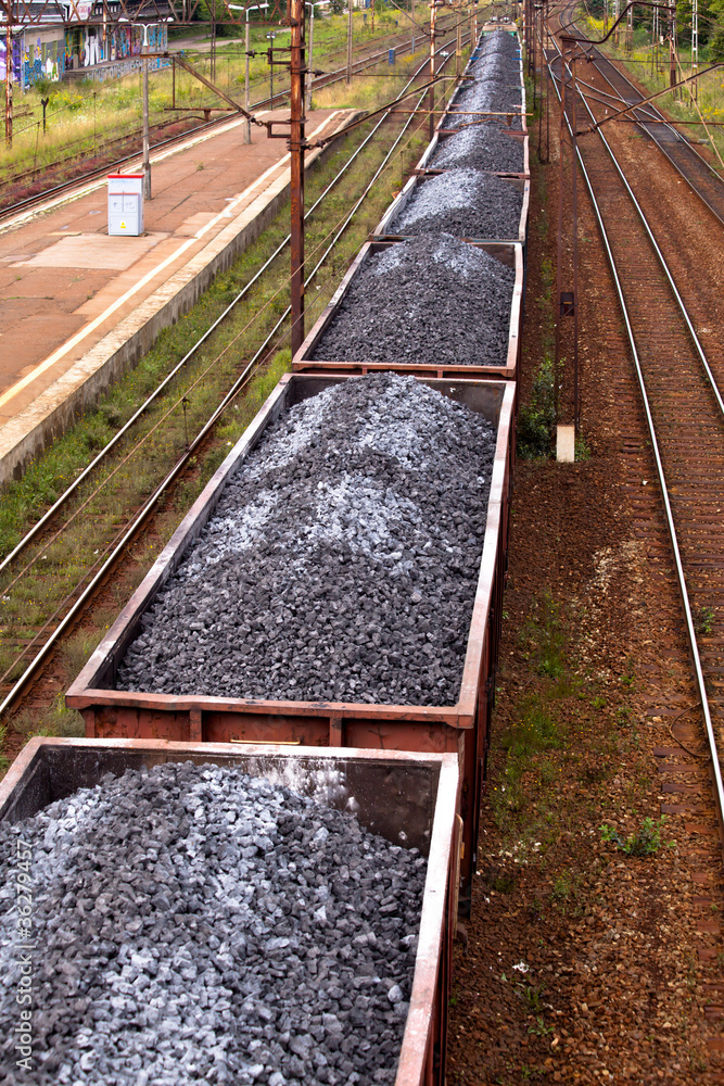 Coal train passing through the station Coal train passing through the station