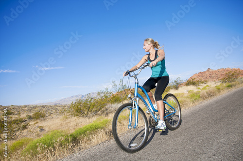Healthy active Woman on a bike ride Outdoors