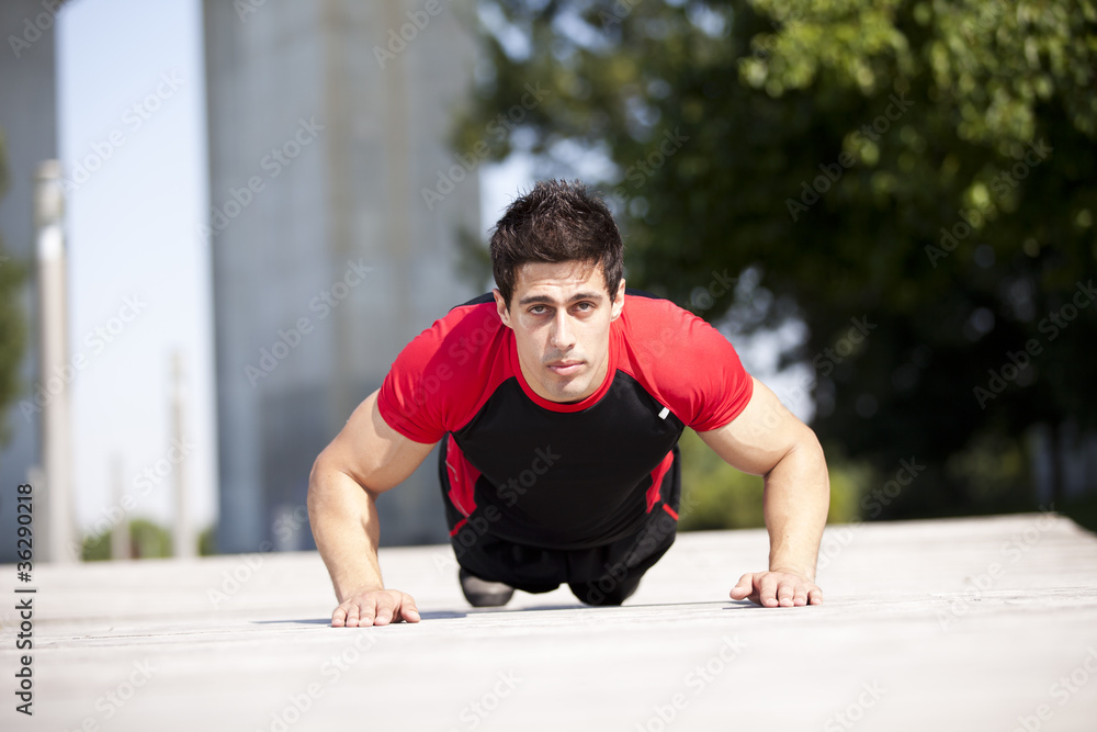 Athlete man making pushups Athlete man making pushups