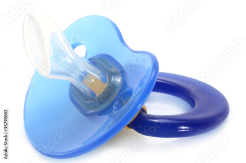 Fényképezés Blue baby silicone pacifier on a white background