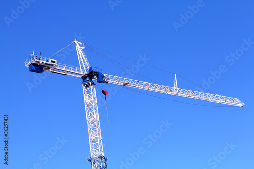 Image of isolated crane at the construction side