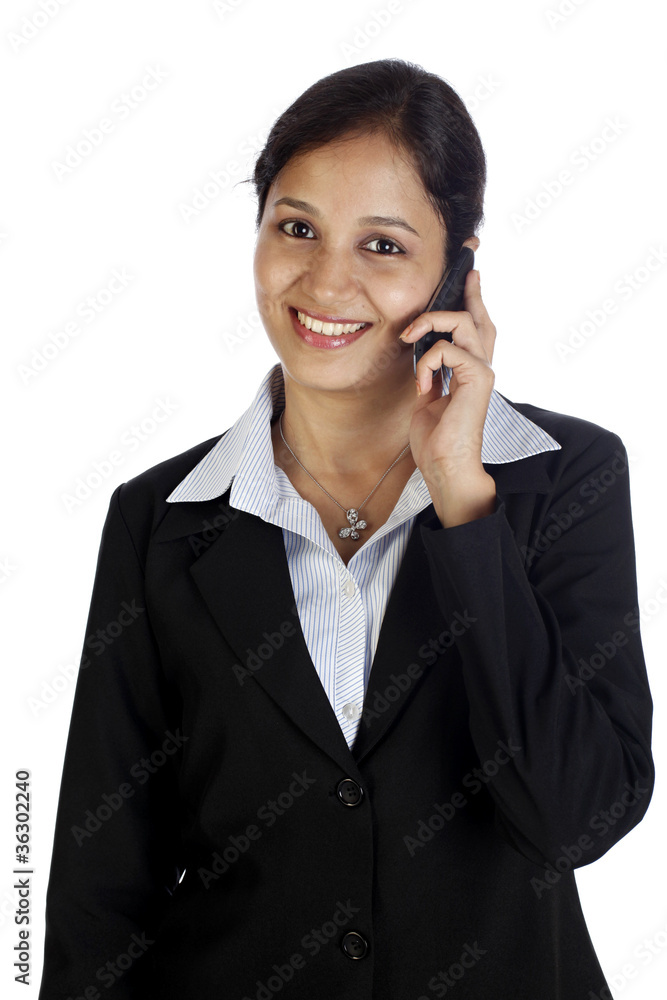 Young business woman talking on cellphone Young business woman talking on cellphone