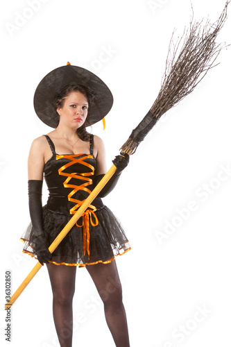 sexy girl in Halloween witch with broom photo