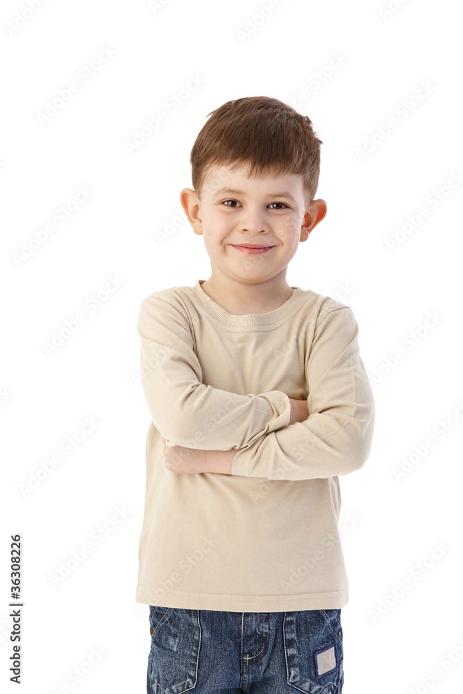 Cute little boy standing arms crossed smiling Cute little boy standing arms crossed smiling