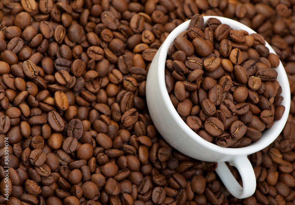 Fototapeta premium White cup with coffee grains