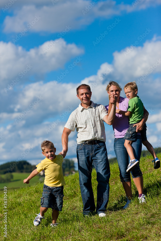 Happy family in summer on a walk