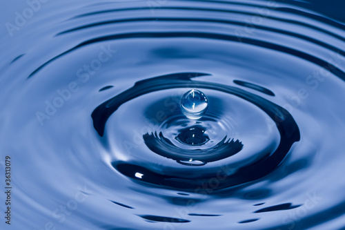 Dark Blue Spherical drops of water floating