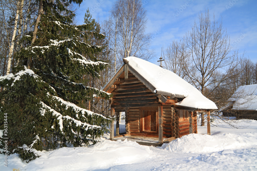 wooden chapel in winter village