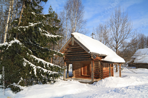 wooden chapel in winter village