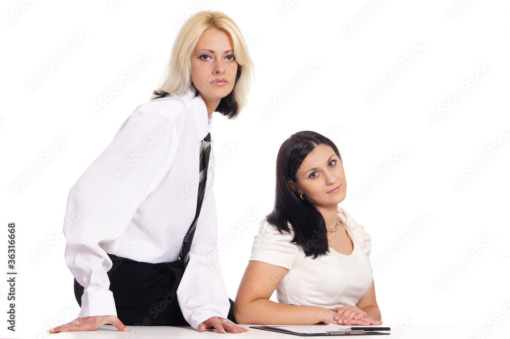 cute female couple posing at table on white cute female couple posing at table on white