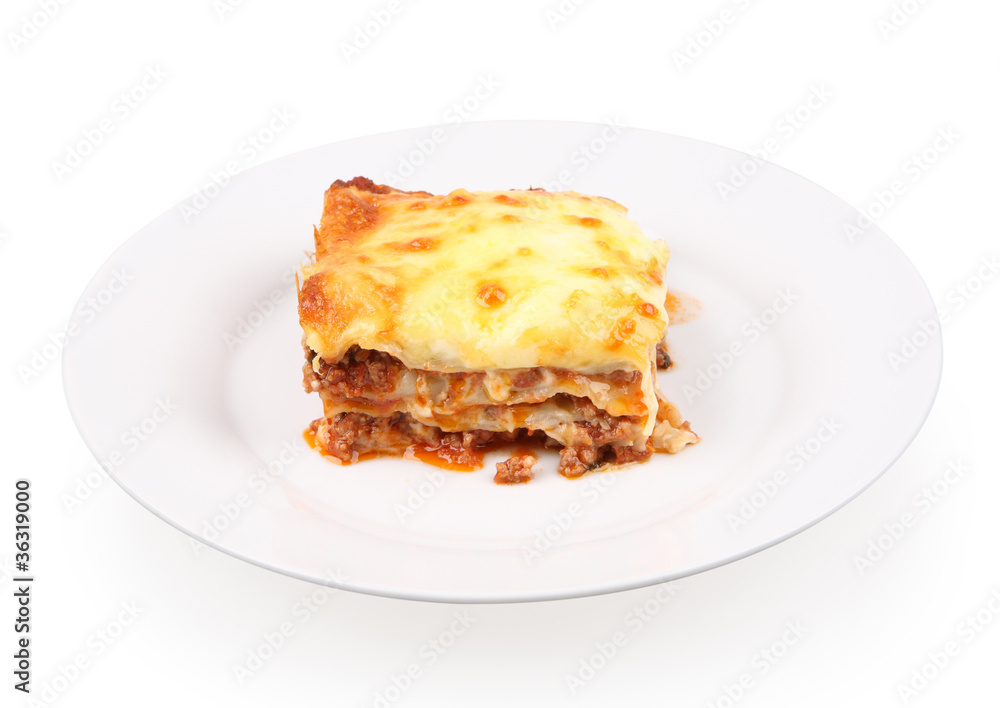 classic lasagna bolognese on a white dish isolated