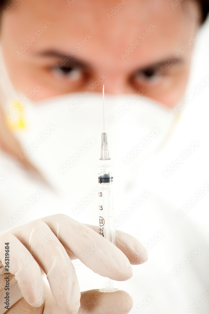 Doctor in a mask with a syringe Doctor in a mask with a syringe