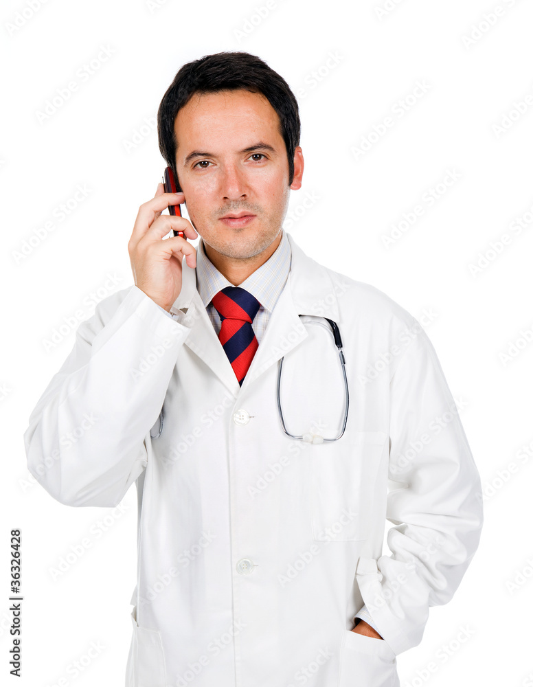 young doctor talking on the phone against white background young doctor talking on the phone against white background