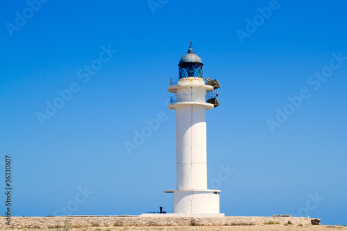 Formentera Barbria Lighthouse in blue sky
