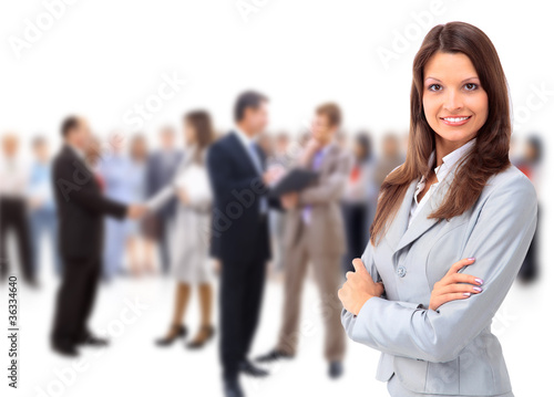Happy young business woman standing in front