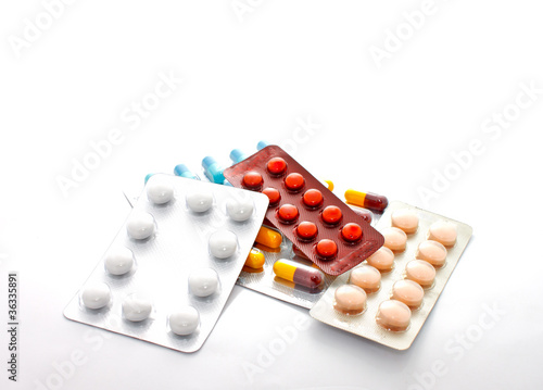 blister packs of pills on the white background