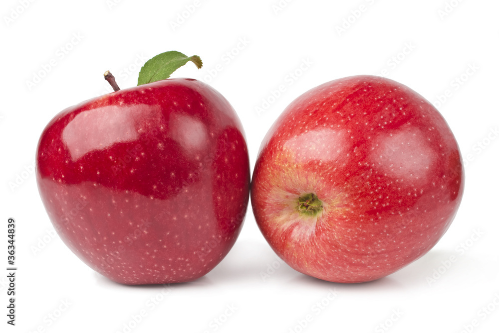 Red apples with leaves isolated on white