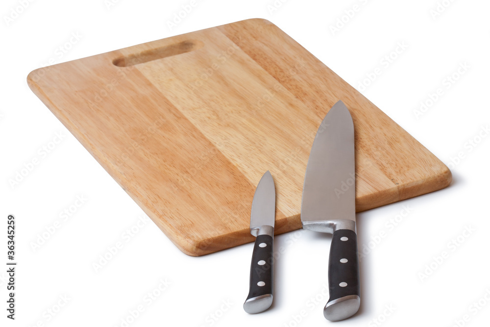 table knife and wooden cutting board