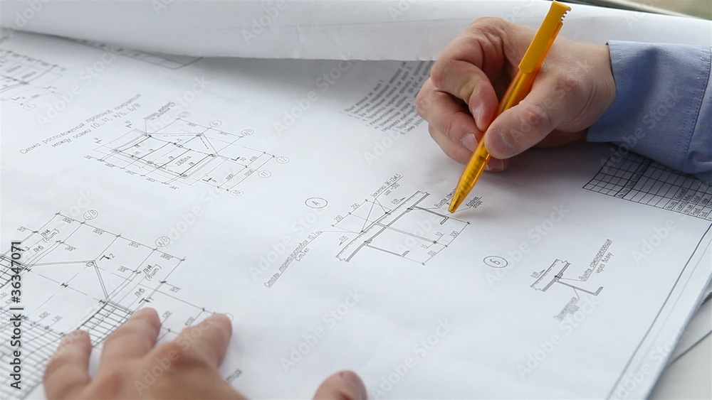 engineer checks the construction drawings engineer checks the construction drawings