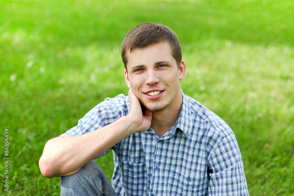 handsome smiling young man enjoying in nature handsome smiling young man enjoying in nature