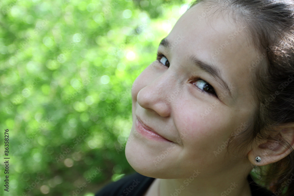 endearing cute girl in the beautiful morning park outdoor
