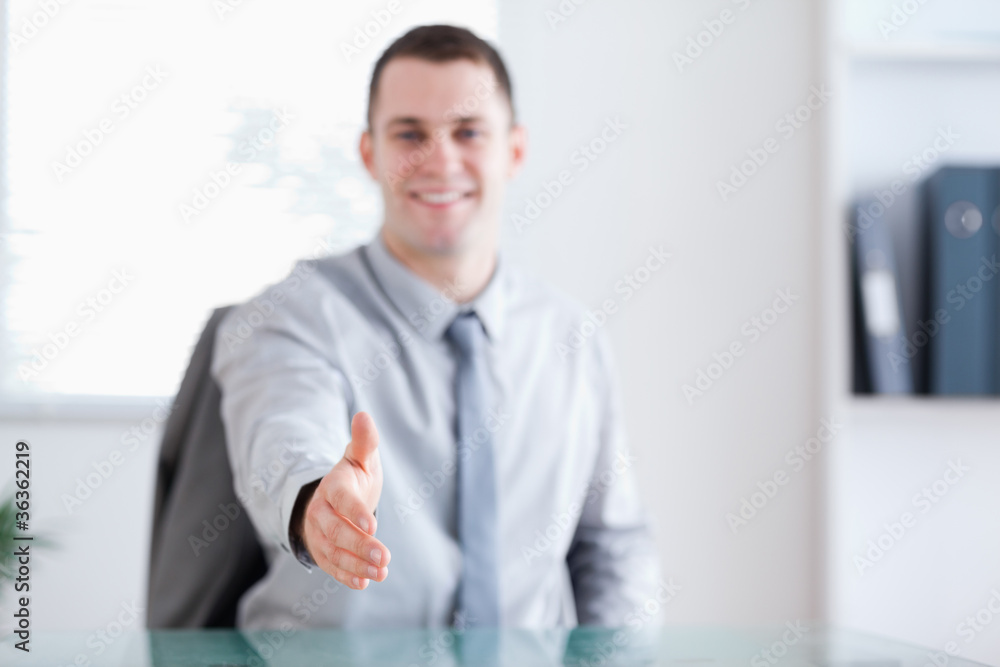 Smiling businessman greeting negotiation partner Smiling businessman greeting negotiation partner