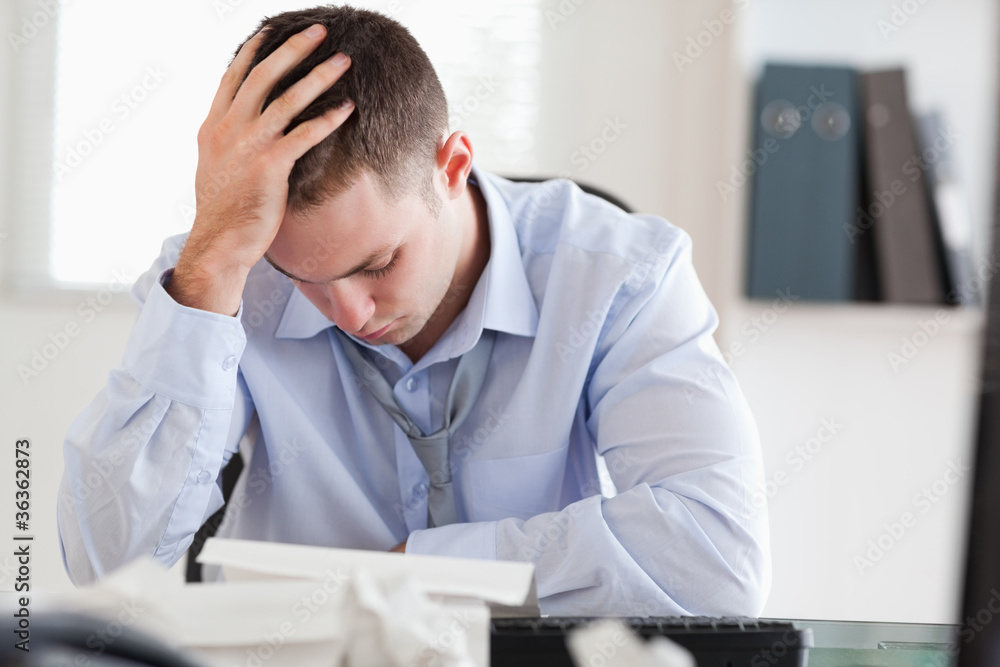 Businessman stressed while doing his accounting Businessman stressed while doing his accounting
