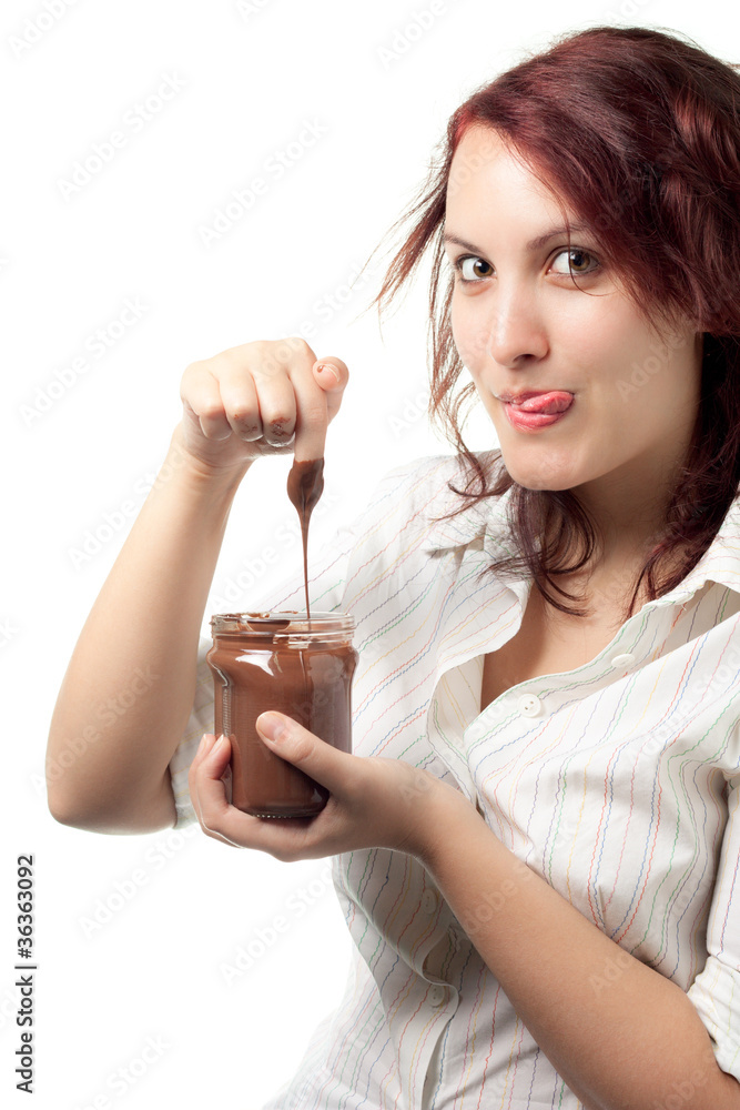 Fototapeta premium Greedy Woman Taking Chocolate Spread from a Jar