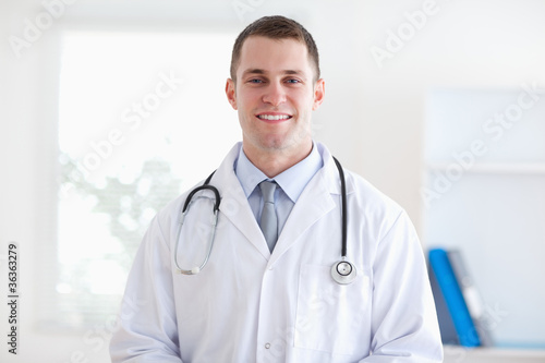Smiling doctor in his practice