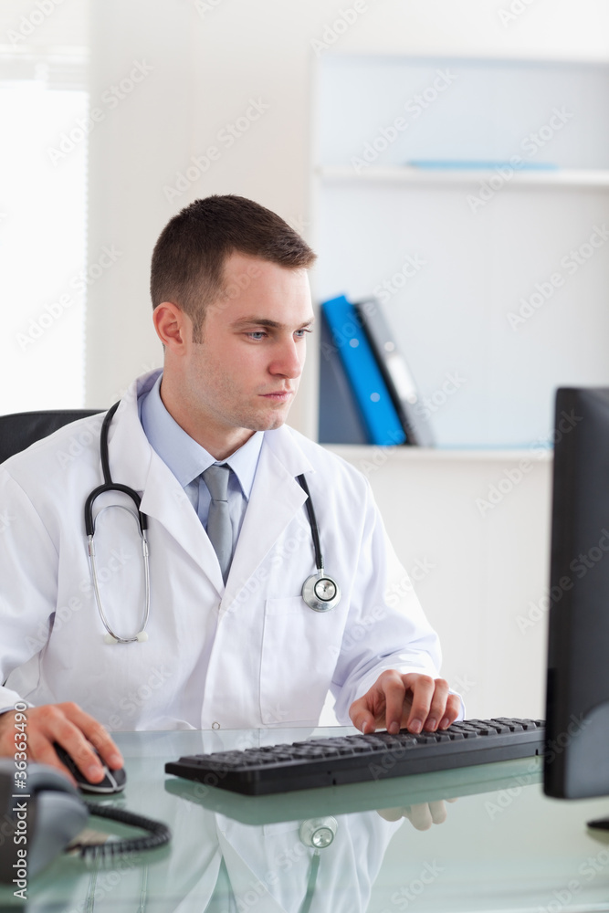 Doctor working with his computer Doctor working with his computer