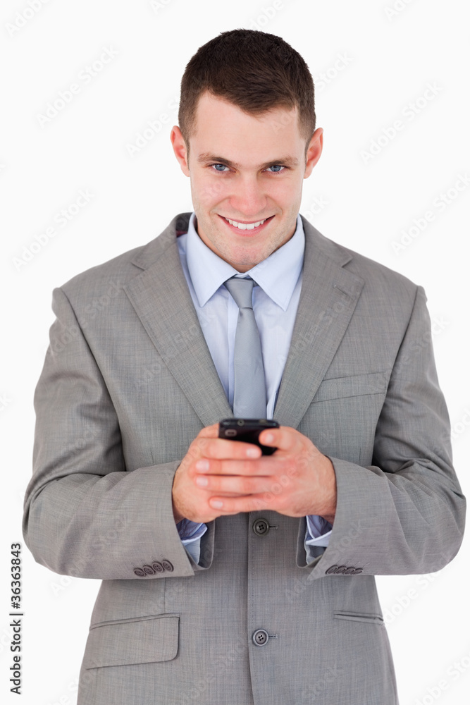 Close up of businessman getting good news via text message Close up of businessman getting good news via text message