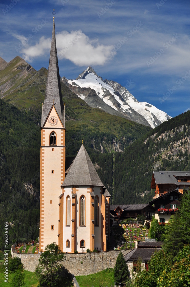 Heiligenblut church in front of Grossglockner peak, Austria