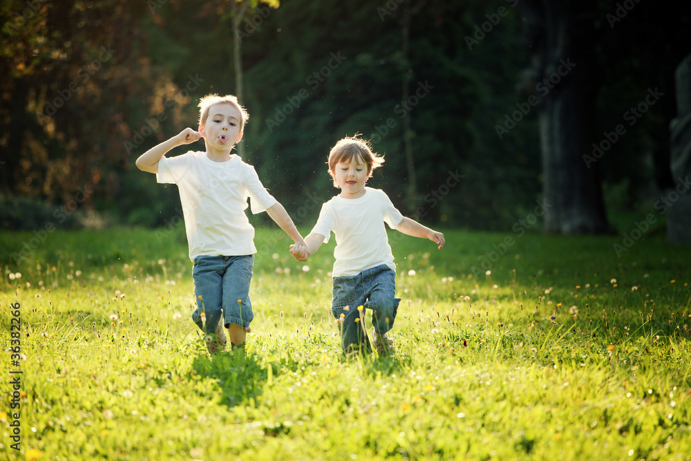 Fototapeta premium Children Running in Meadow