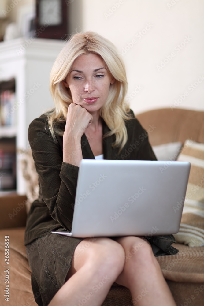 Beautiful Blond Young Woman Working On Her Laptop Computer Beautiful Blond Young Woman Working On Her Laptop Computer