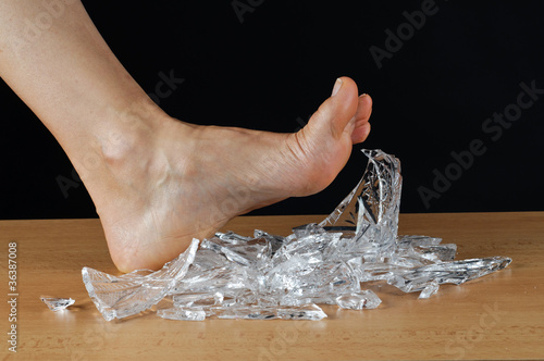 Foot and broken glass