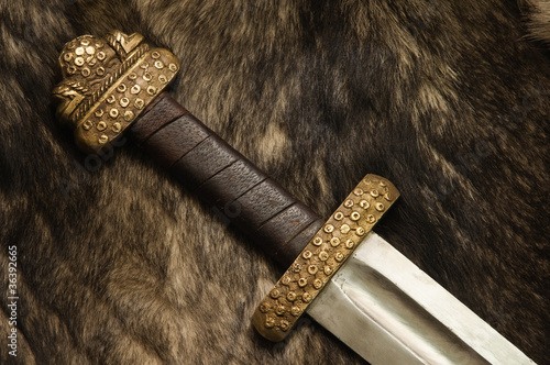 Still life with scandinavian sword on a fur
