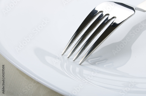 Fork on white plate