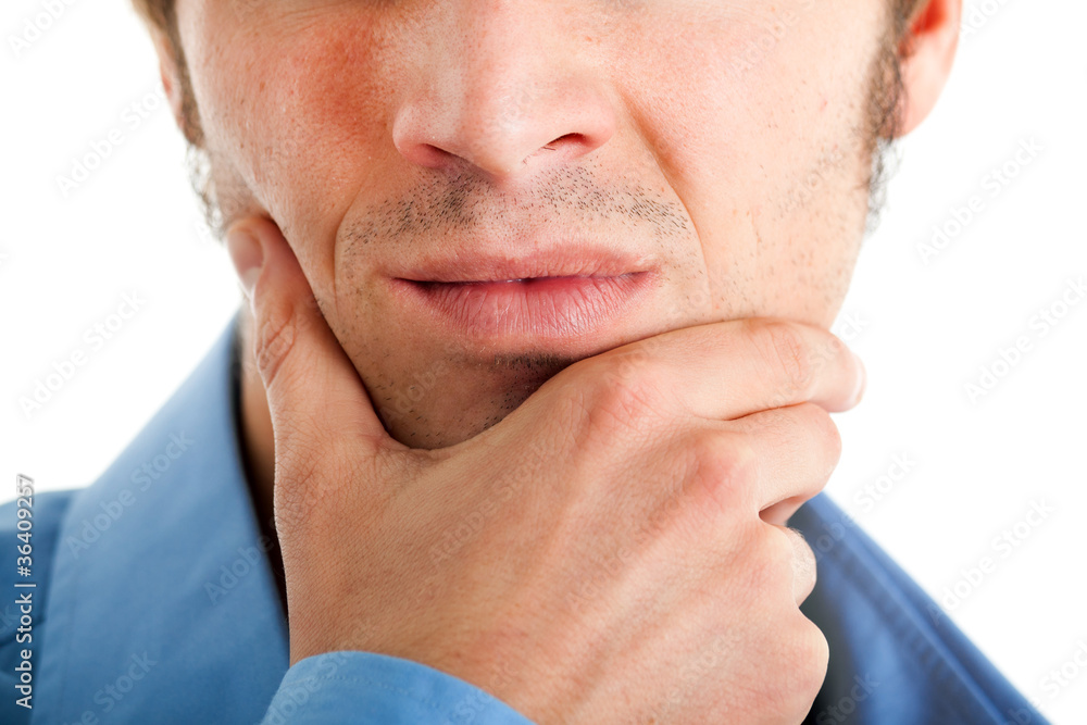 Naklejka premium Businessman with hand on his chin