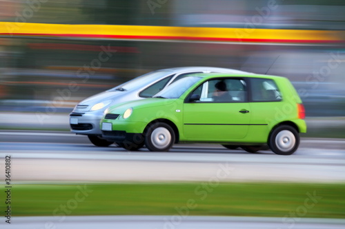 Race cars on city streets, blur and transportation background © wojtek