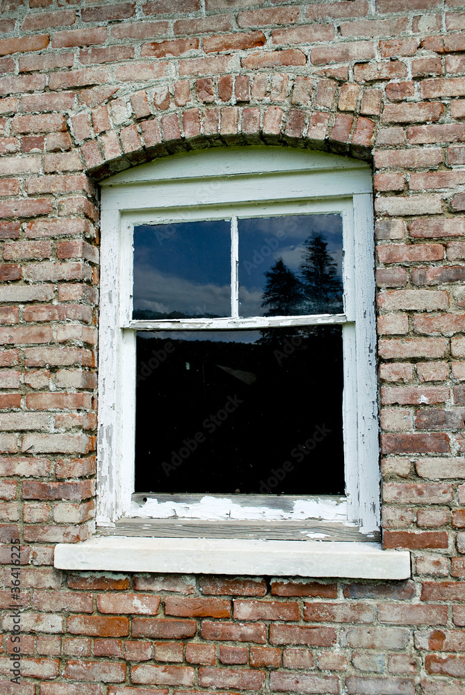 old window in brick building