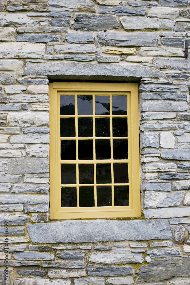 Beautiful window in stone building
