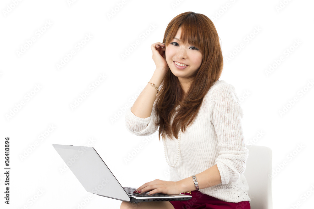 Beautiful asian woman using a laptop computer Beautiful asian woman using a laptop computer